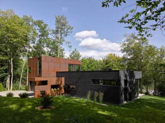 Contemporary Canadian Lake House Features Black Dyed Cedar and Rusted Metal Cladding
