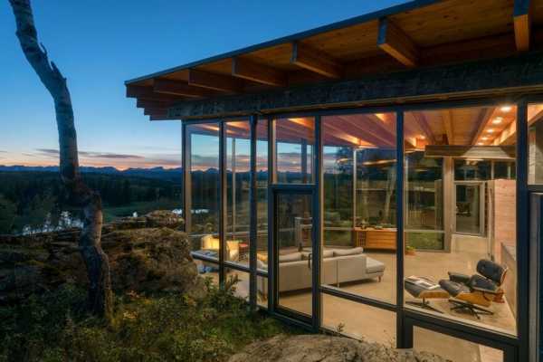 One-Bedroom Cabin Nestled Between Two Massive Lichen-Covered Rocks