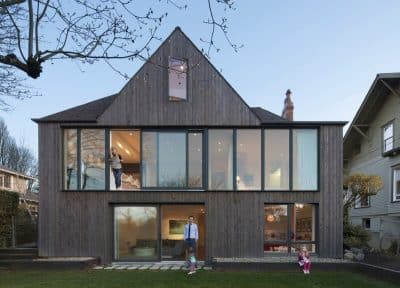 Janus Residence: 1930 Brick Tudor Transformed in a House with Two Faces