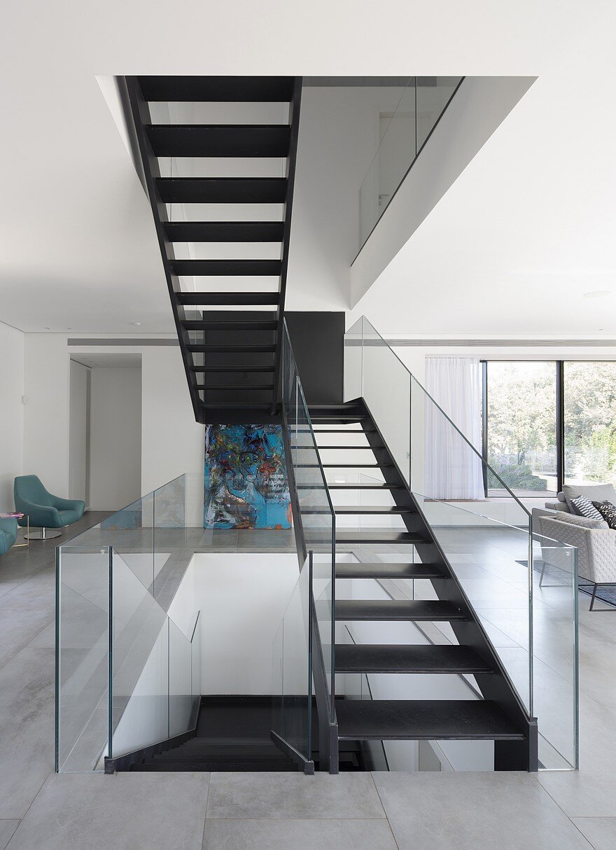 L-Shaped Home Organized Around a Central Steel Staircase 5