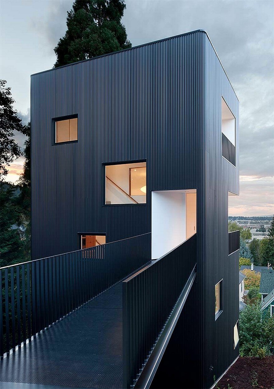 Modern Vertical House Accessed by a Steel Pedestrian Bridge
