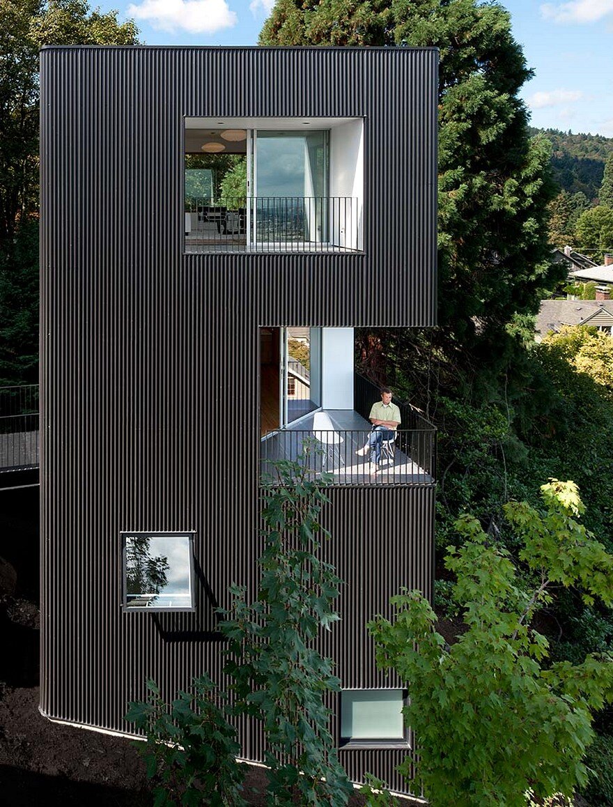 Modern Vertical House Accessed by a Steel Pedestrian Bridge 1