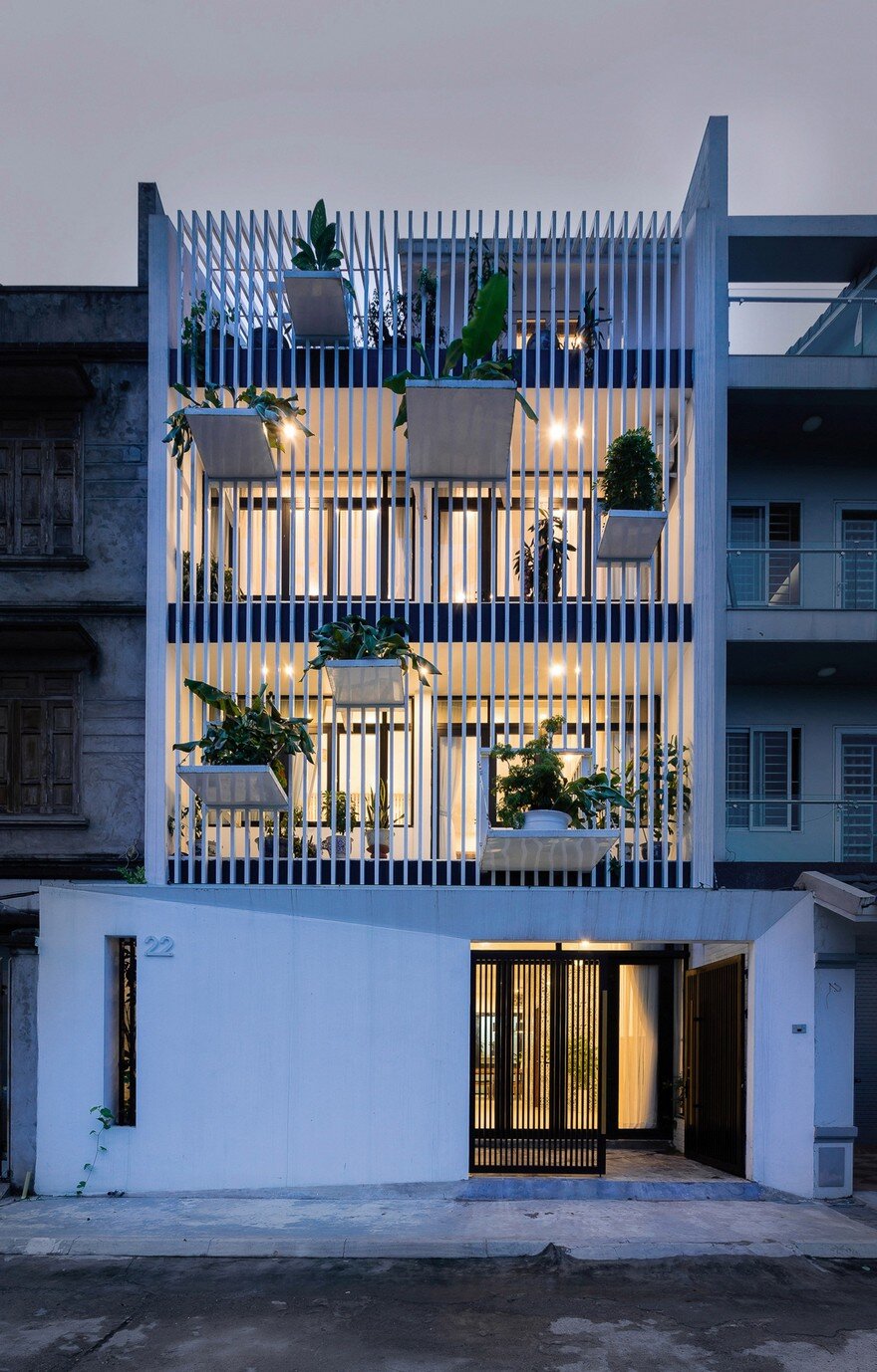 DANstudio Renovates House in Hanoi with Green Balconies Facade 14