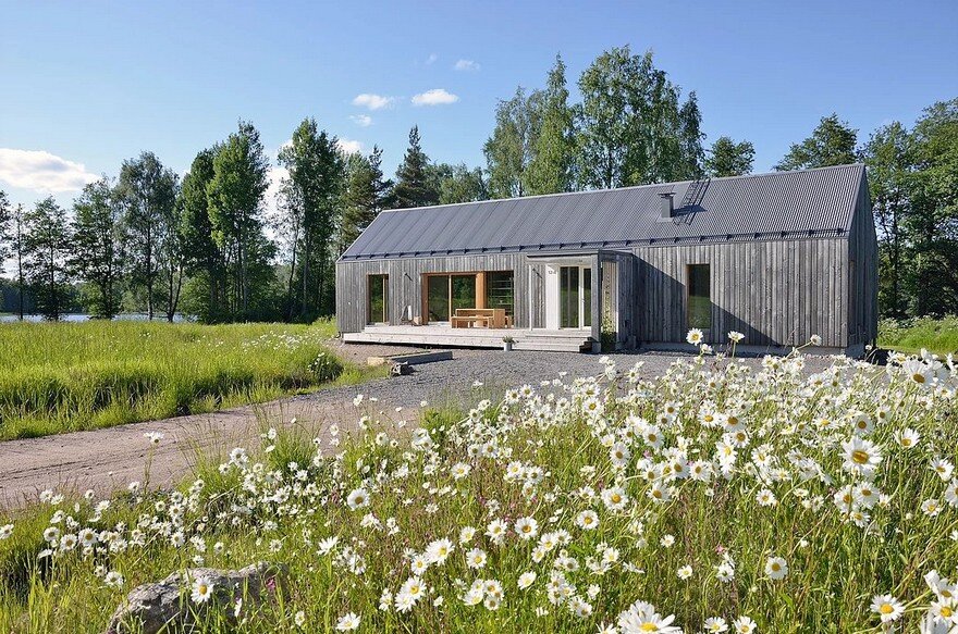 Oblong House is Designed to Sit Naturally in the Open Field Landscape