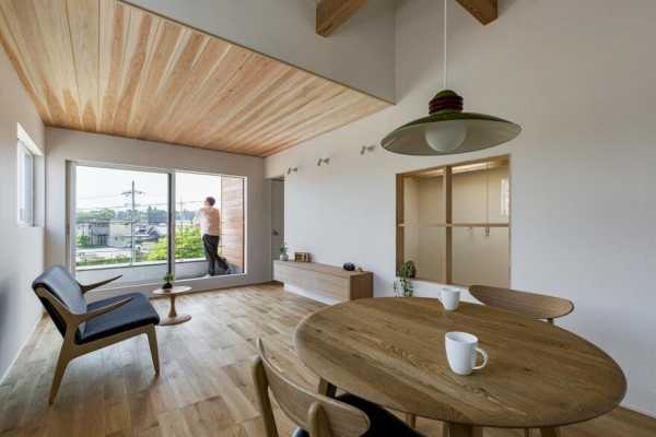 Box-Shaped Japanese Home with Warm Minimalist Interior Design