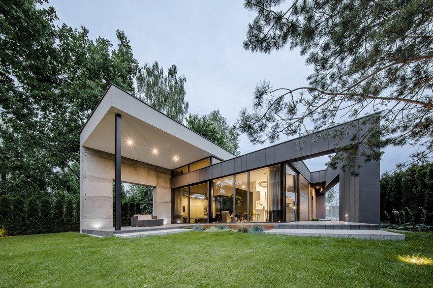 L-Shaped Family Home Exhibiting A Distinctive Roof And Custom Interior