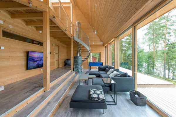 A Finnish Retreat Features a Pyramidal Roof and a Glass Wall Facade