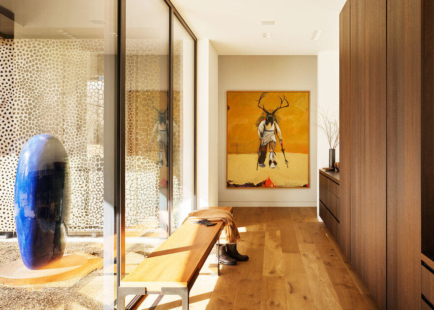 The entrance hall, full of natural light, sets a calming tone.